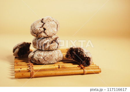 chocolate sweet cookies on orange color background  117116617
