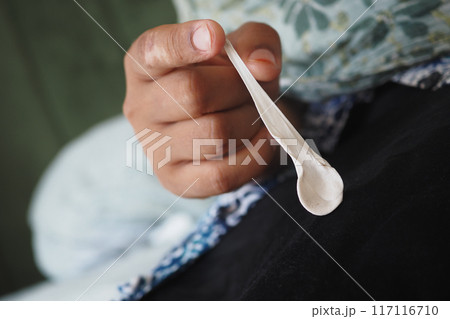 Detailed instructions for effectively removing chewing gum from fabric, with closeup view focus 117116710