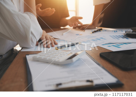 Business meetings to analyze investment strategies and brainstorm sales plans for a more profitable business. Business meetings to analyze investment strategies and brainstorm sales plans for a more profitable business. 117117031
