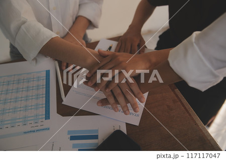 Leaders of business organizations join hands after the meeting is complete. Business partner meeting ideas. Leaders of business organizations join hands after the meeting is complete. Business partner meeting ideas. 117117047