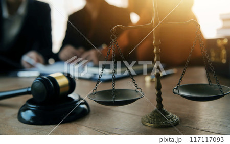 Lawyer, legal advisor, businessman brainstorming information on agreement details Business contracts in legal processing books for accuracy in contract documents. joint financial investment. 117117093