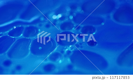 Serum bubbles. Oil fluid. Defocused blue color transparent paint water round droplets floating texture abstract art background. 117117853