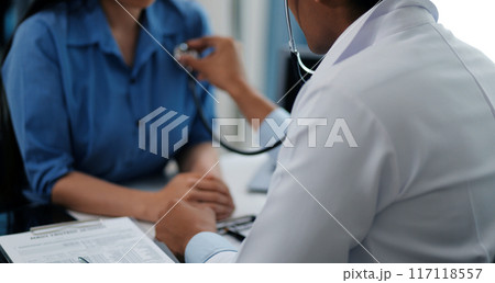 Doctor using a stethoscope checking patient with examining, presenting results symptom and recommend treatment method, Healthcare and medical concept. 117118557