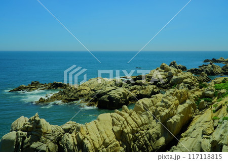rocky beach scenery with ocean horizon rocky beach scenery with ocean horizon 117118815