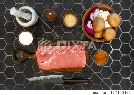 Overhead view of raw pork fillet ready for cooking 117120366