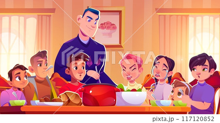 Big family sitting together at dinner table 117120852