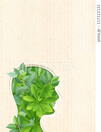 Green leaves and human head in paper cut style. Vertical banner with eco paper texture. Paper cardboard background. Recycled carton material. Ecology and zero waste concept. Copy space for text Green leaves and human head in paper cut style. Vertical banner with eco paper texture. Paper cardboard background. Recycled carton material. Ecology and zero waste concept. Copy space for text 117122132