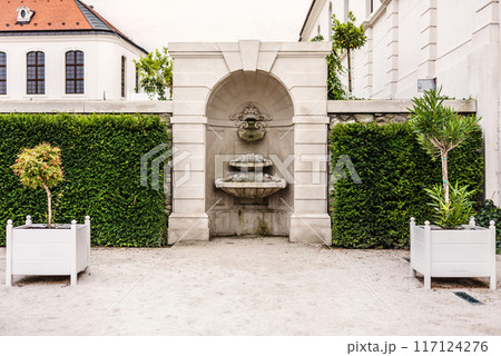 Decorative Fountain in Courtyard of Baroque Garden 117124276