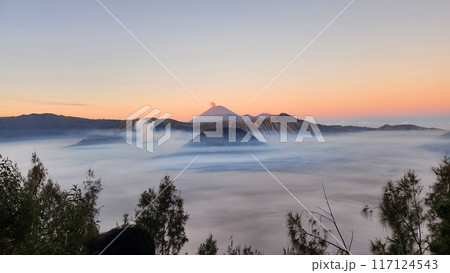 Scenic view of Bromo Mountain silhouette against clear sky at sunrise Scenic view of Bromo Mountain silhouette against clear sky at sunrise 117124543