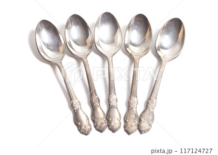 Old teaspoons isolated on white background Old teaspoons isolated on white background 117124727