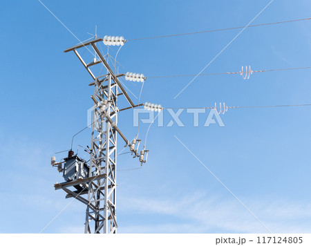 Electric Transmission Tower Against Blue Sky 117124805