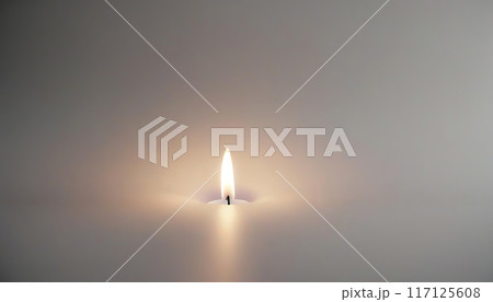 close up of burning candle light close up of burning candle light 117125608