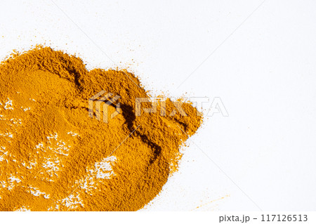 Scattered ground turmeric root on white background, spice texture, copy space for text Scattered ground turmeric root on white background, spice texture, copy space for text 117126513
