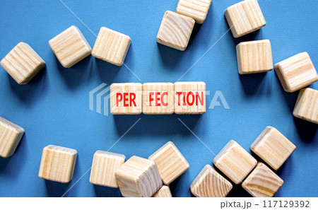 Perfection symbol. Concept word Perfection on beautiful wooden blocks. Beautiful blue background. Business perfection concept. Copy space. Perfection symbol. Concept word Perfection on beautiful wooden blocks. Beautiful blue background. Business perfection concept. Copy space. 117129392