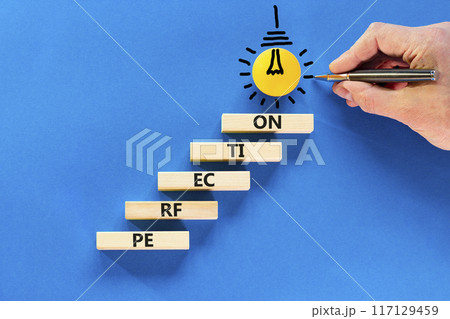 Perfection symbol. Concept word Perfection on beautiful wooden blocks. Light bulb icon. Businessman hand with pencil. Beautiful blue background. Business perfection concept. Copy space. Perfection symbol. Concept word Perfection on beautiful wooden blocks. Light bulb icon. Businessman hand with pencil. Beautiful blue background. Business perfection concept. Copy space. 117129459