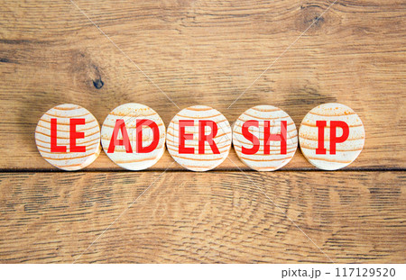 Leadership symbol. Concept word Leadership on beautiful wooden circles. Beautiful wooden background. Business leadership concept. Copy space. 117129520