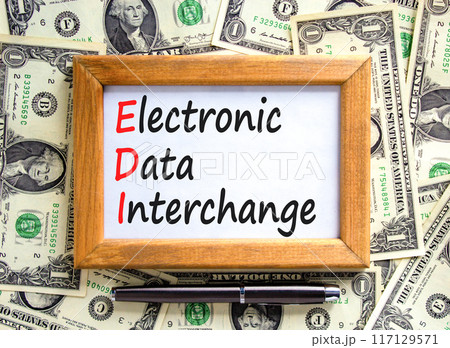 EDI electronic data interchange symbol. Concept words EDI electronic data interchange on wooden frame. Beautiful dollar background. Business and EDI electronic data interchange concept. Copy space 117129571