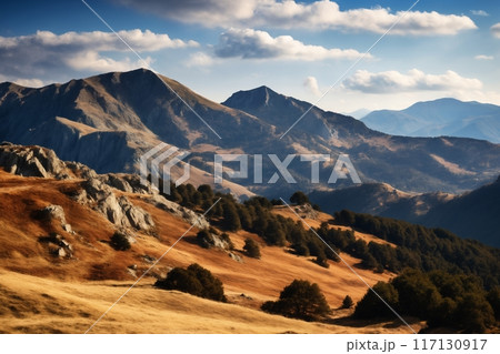 a beautiful landscape with mountains at sunset, sunlight in a dramatic sky with clouds, beautiful nature 117130917