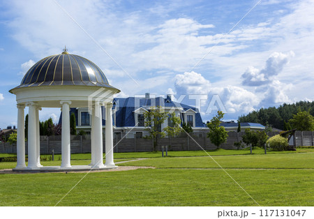 Rotunda and private house on a summer day. Europe 117131047