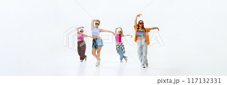 Banner. In vibrant streetwear, dancers capture essence of modern dance with bold poses and energetic expressions against white studio background. 117132331