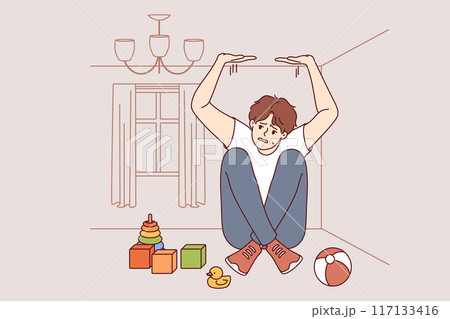 Boy suffers from claustrophobia, feeling pressure of walls and sitting in small room with toys 117133416