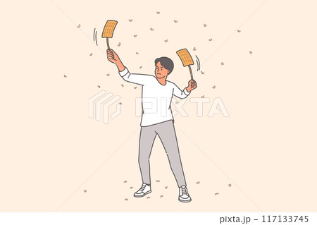 Man uses fly-flaps to fight flies and mosquitoes, flock to light at night and bite people 117133745