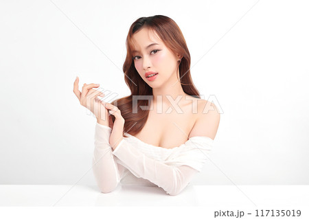 Beautiful young asian woman with clean fresh skin on white background, Face care, Facial treatment, Cosmetology, beauty and spa, Asian women portrait. Beautiful young asian woman with clean fresh skin on white background, Face care, Facial treatment, Cosmetology, beauty and spa, Asian women portrait. 117135019
