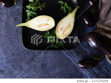 Hands holding a large plate with various fresh farm vegetables. Diet. Balance. The concept of healthy organic food Hands holding a large plate with various fresh farm vegetables. Diet. Balance. The concept of healthy organic food 117135204