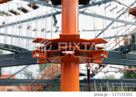 Children Playground with Modern Slide, Rope Net Bridge, Climbing Swings, Climbers. Empty Wooden Playground made of Eco Materials 117135301