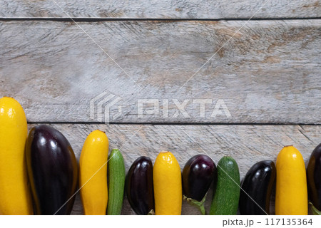 Zucchini. Fresh raw organic zucchini ready for cooking, top view with copy space Zucchini. Fresh raw organic zucchini ready for cooking, top view with copy space 117135364