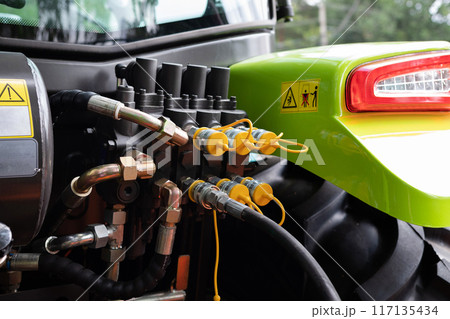 Fragment of yellow industrial diesel engine for electrical generator in power station Fragment of yellow industrial diesel engine for electrical generator in power station 117135434