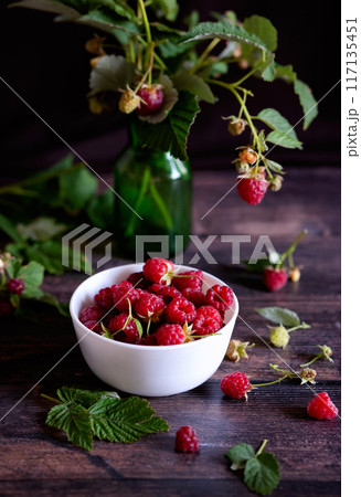 Fresh raspberries in bowl. Ripe juicy fresh raspberries. Organic raspberries, healthy food, vitamins, summer berry fruit. Long banner format. place for text. 117135451
