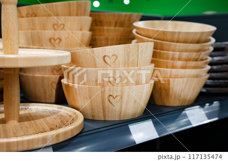 Wooden breakfast tray on the shelf in the store. Environmental friendliness. Reuse. Handmade work. 117135474