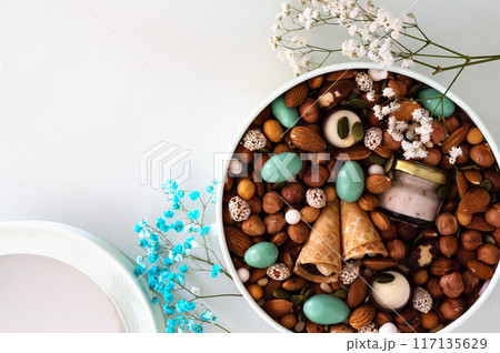 Peanuts in box. Gift to Women's Day (8 March), Women's Day. Mother's Day Valentines day. Festive round box. 117135629