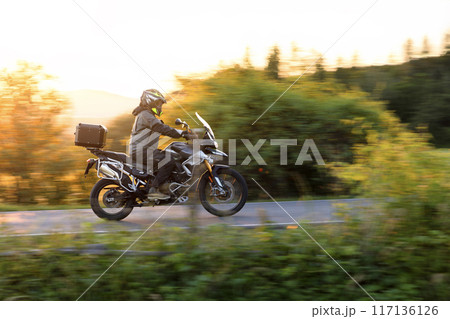 Motorcycle on the Road with Beautiful Sunset Light. Motorcycle on the Road with Beautiful Sunset Light. 117136126