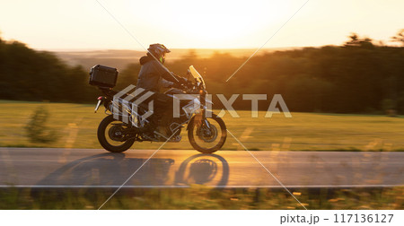 Motorcycle on the Road with Beautiful Sunset Light. Motorcycle on the Road with Beautiful Sunset Light. 117136127