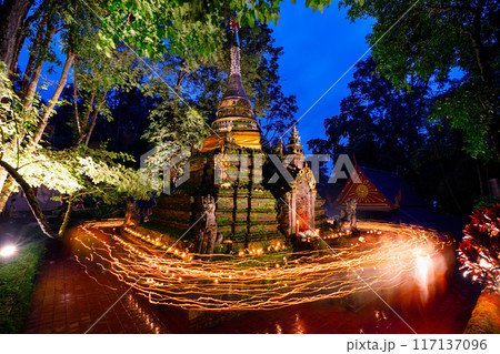 Buddhism light waving rite in Asalha Puja Day At Wat Pha Lat. This famous buddhist forest temple is located in Chiang Mai, Thailand. Buddhism light waving rite in Asalha Puja Day At Wat Pha Lat. This famous buddhist forest temple is located in Chiang Mai, Thailand. 117137096