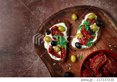 sandwich with cream cheese, dried tomatoes, olives, breakfast, top view, sandwich with cream cheese, dried tomatoes, olives, breakfast, top view, 117137210