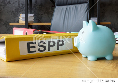Piggy bank and folder with employee stock purchase plan ESPP. Piggy bank and folder with employee stock purchase plan ESPP. 117138143