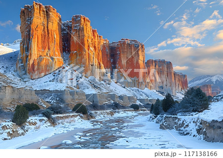 Dramatic Winter Landscape at Sunset - Scenic Snow-Covered Rock Formations and Frozen River Generative AI 117138166
