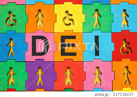 Multicolored puzzle with figures and abbreviation DEI diversity, equity and inclusion. Multicolored puzzle with figures and abbreviation DEI diversity, equity and inclusion. 117138237