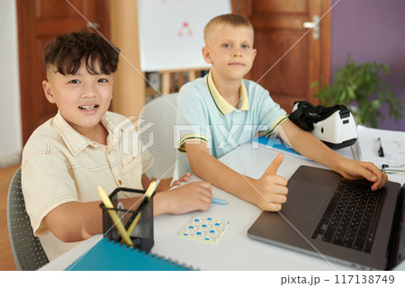 Smiling Boys Working Together on Digital Project Smiling Boys Working Together on Digital Project 117138749