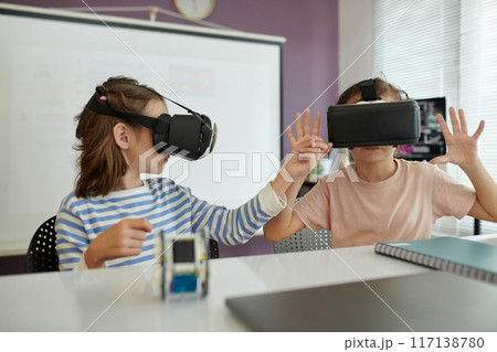Children Enjoying Virtual Reality Headsets Indoors 117138780