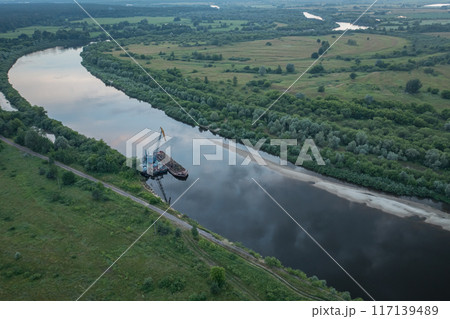 The process of cleaning the river from pollution. Barge and river crane working on the river The process of cleaning the river from pollution. Barge and river crane working on the river 117139489