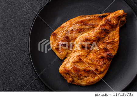 Delicious fresh grilled chicken fillet with spices and herbs Delicious fresh grilled chicken fillet with spices and herbs 117139732