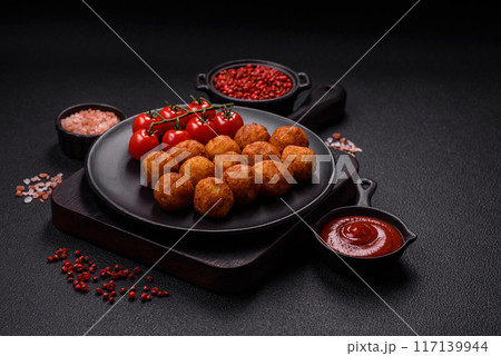 Delicious crispy balls breaded with mozzarella cheese, salt and spices Delicious crispy balls breaded with mozzarella cheese, salt and spices 117139944