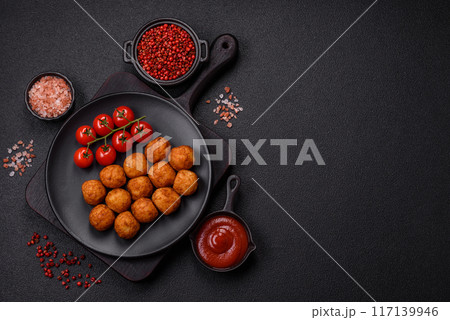 Delicious crispy balls breaded with mozzarella cheese, salt and spices Delicious crispy balls breaded with mozzarella cheese, salt and spices 117139946
