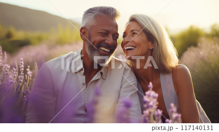 Mature Mixed Race Couple Enjoying Sunshine in Summer Lavender Field copy space 117140131