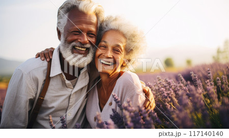 Mature Mixed Race Couple Enjoying Sunshine in Summer Lavender Field copy space 117140140