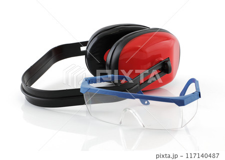 Ear defenders and safety glasses on white with reflection 117140487